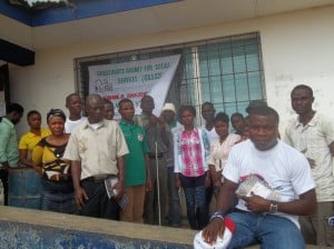 Staff and volunteers from AJWS grantee Grassroots Agency for Social Services (GRASS) in Liberia