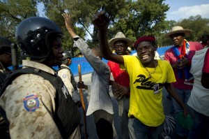 Anti-government protesters in Port-au-Prince last month called for President Michel Martelly’s resignation. (HECTOR RETAMAL/AFP/Getty Images)