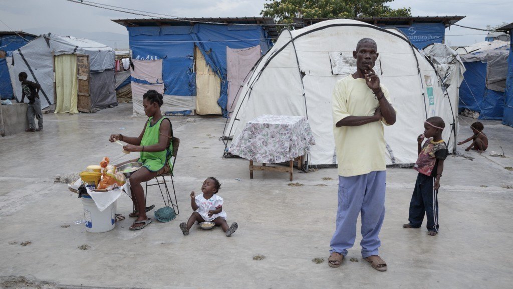 Haitians in a tent camp