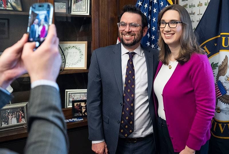two people smiling together in an office on capitol hill
