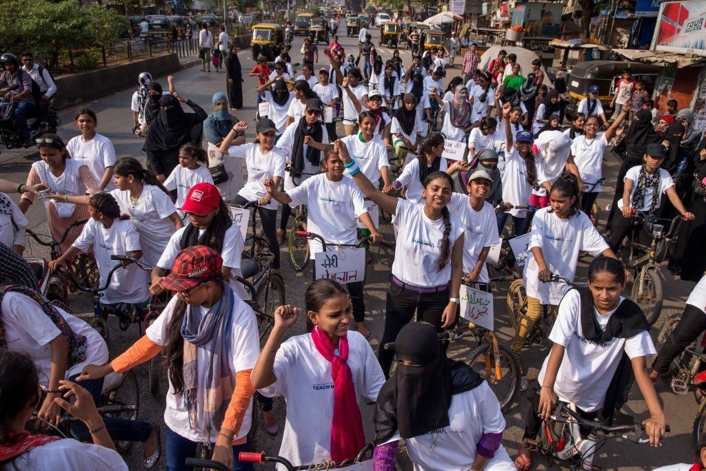 Nearly 100 women and girls from Awaaz rode through the busy streets of a conservative community in Mumbai to rally for gender equality. Photo by Jonathan Torgovnik.