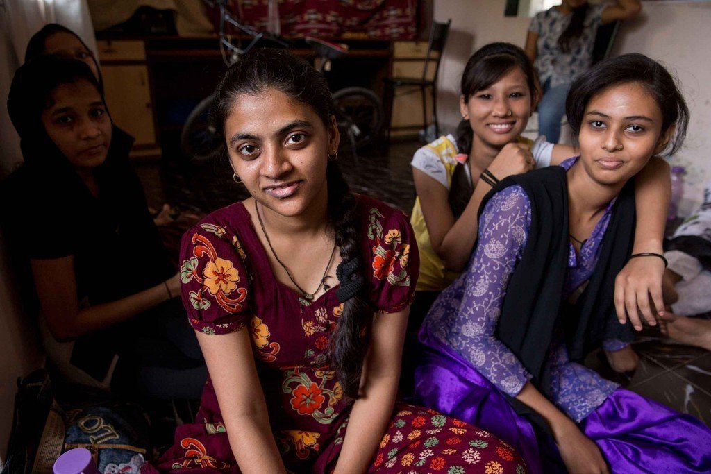 Adolescent girls hang out at Awaaz-a-Niswaan in Mumbai. Formed 30 years ago to challenge laws in Muslim communities that restrict women’s rights, Awaaz now organizes gatherings for women and girls to learn how to advocate for themselves. They offer computer and English classes that provide young women with strict parents an excuse to get out of the house and seek support from friends. Photo by Jonathan Torgovnik.