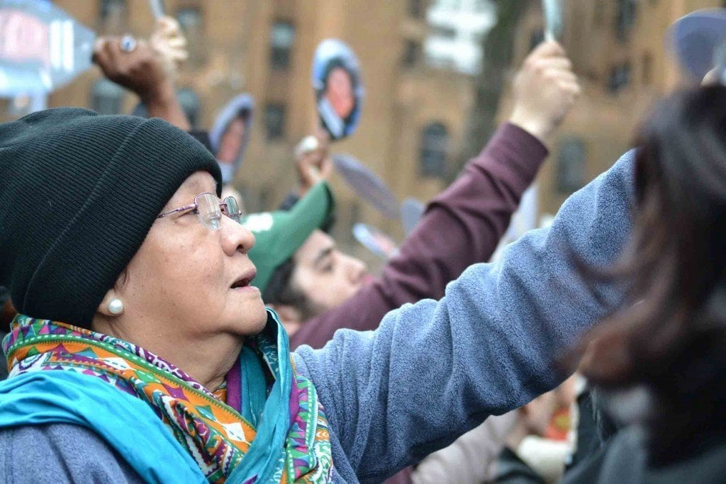 A protestor at the rally joins a chorus of chants for justice for Berta. Photo by Angela Cave