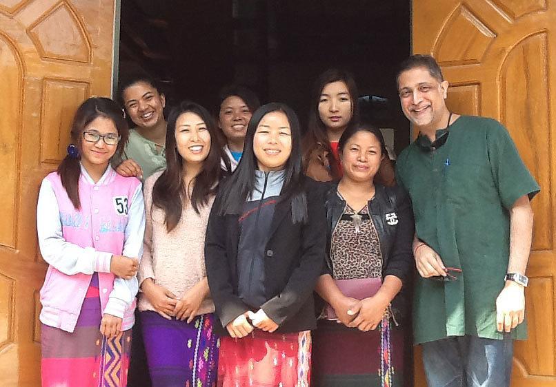 AJWS Senior Policy Advisor, Government Affairs Ronnate Asirwatham (top left) and AJWS Director of Natural Resource Rights Nikhil Aziz (right) with members of AJWS grantee the Kachin Women's Association of Thailand 