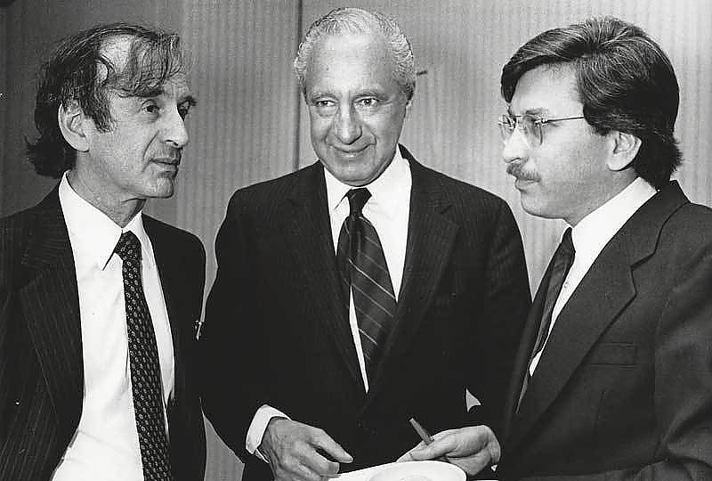 AJWS founders Larry Phillips (center) and Laurence Simon (right) celebrate AJWS’s founding in 1985 with author Elie Wiesel, a founding board member.