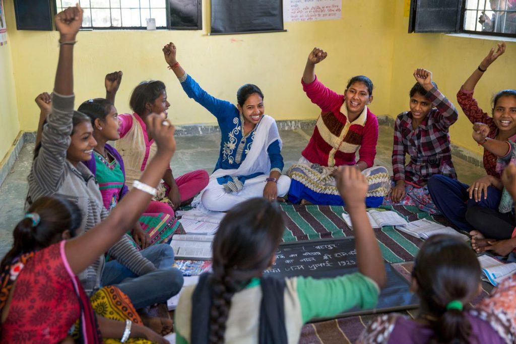 Young women in rural Rajasthan meet at a center for girls, where they can join in group activities and get help with their studies. Some of them have dropped out of school to get married; AJWS grantee Vikalp helps them enroll in study-at-home programs so they can work toward finishing their high school degrees. Photo by Jonathan Torgovnik