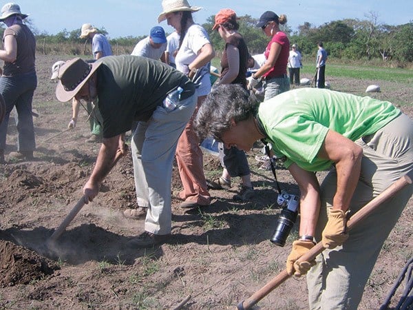 Ruth Messinger and Rabbi David Ellenson, President of Hebrew Union College-Jewish Institute of Religion, help plow a field on an AJWS delegation of rabbis to El Salvador in 2007.