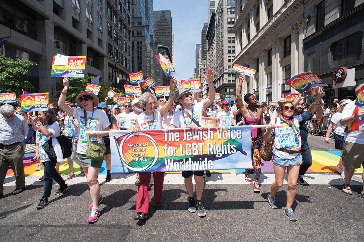 In the 2016 NYC Pride Parade, Ruth Messinger marches alongside AJWS's then-Executive Vice President (now President) Robert Bank, board members, staff and supporters. Photograph by Jeff Zorabedian