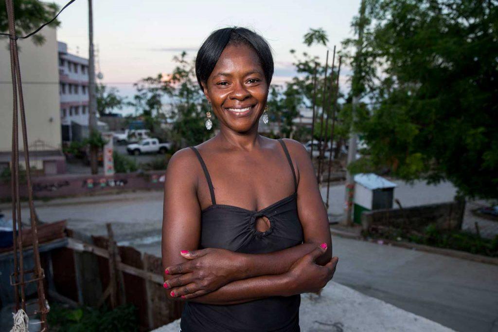 Heroes like Françoise Inocent, who is happy and smiling, are helping communities in Haiti rebuild and recover after Hurricane Matthew. Photograph by Jonathan Torgovnik