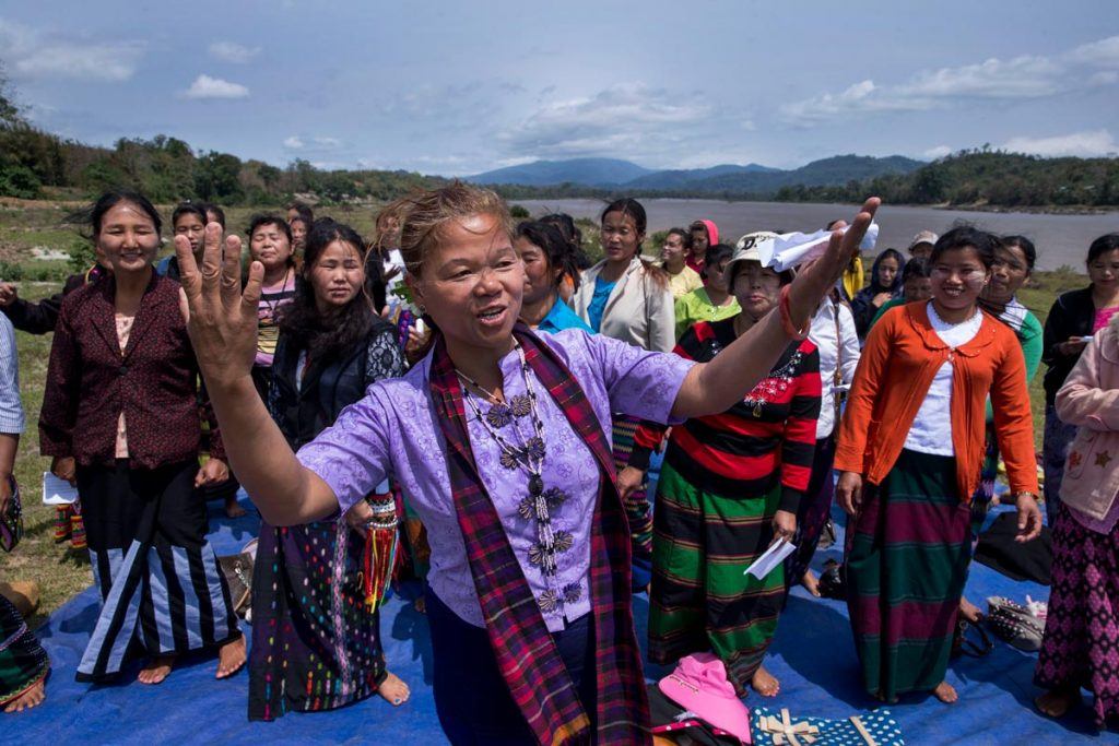 Lu Ra leads a large group women in song and dance, uniting the women from different villages who sing about their river and their leadership. 