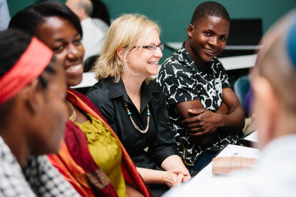 Cantor Jill Abramson (center) listens to the stories of people affected by the 2013 Dominican court ruling that stripped hundreds of thousands of people of their citizenship. They are members of AJWS grantee Reconoci.do, which helps thousands of Dominicans fighting to have their nationality and full citizenship rights recognized by the government. Photograph by Christine Han