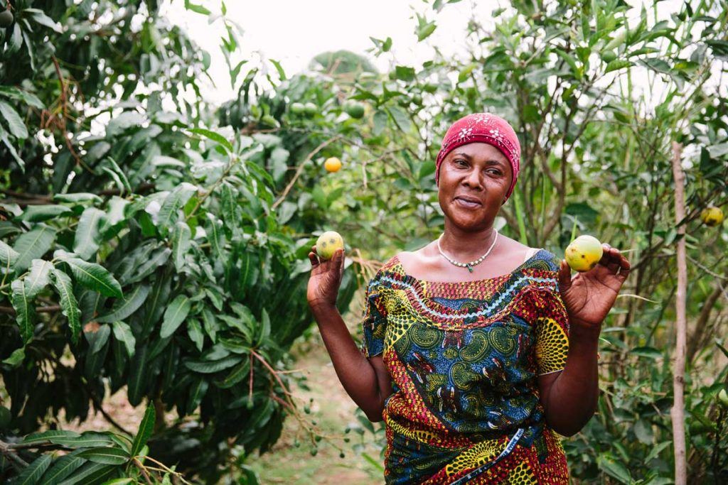 Beatrice Rukanyanga, Coordinator of Kwataniza Women Farmers Group, gave AJWS supporters a tour of her farm earlier this year. Photo by Christine Han.