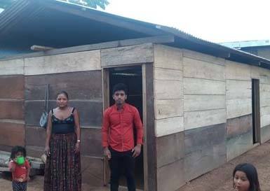 The Quej family outside their rebuilt home. Photo courtesy PDP.