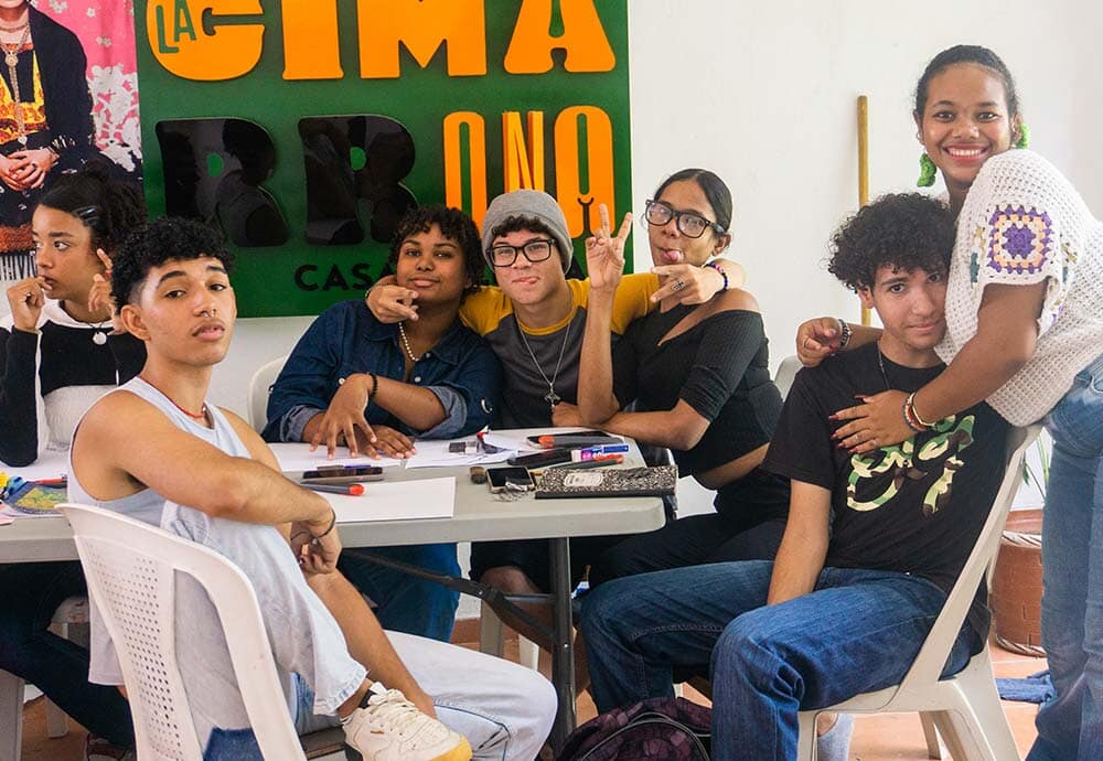group of young people around a table