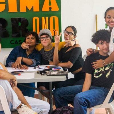 group of young people around a table