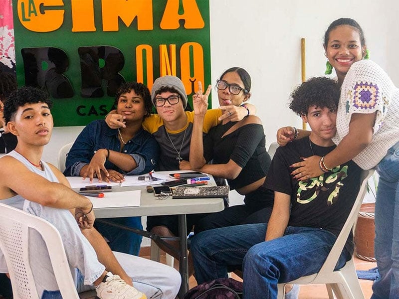 group of young people around a table
