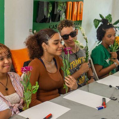 four people at a table with paper in front of them