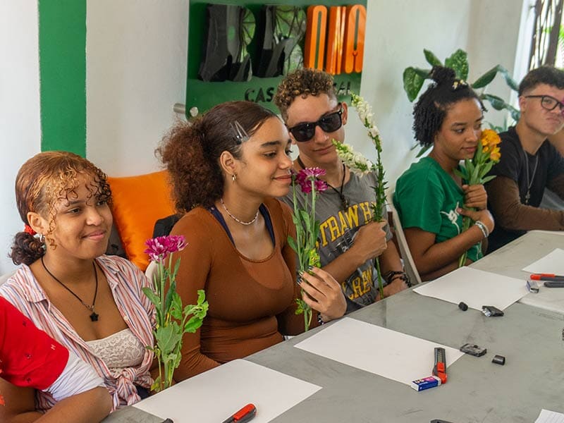 four people at a table with paper in front of them
