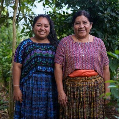 mother and daughter smiling together outdoors