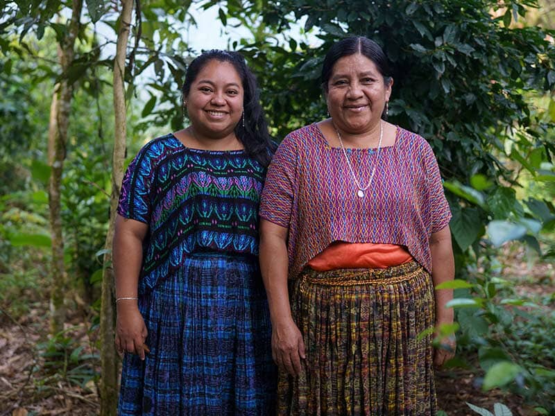 mother and daughter smiling together outdoors