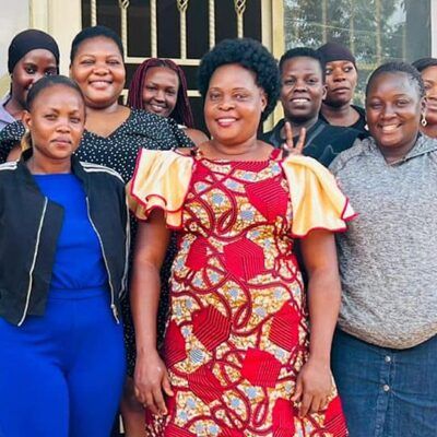 group of people smiling together outside