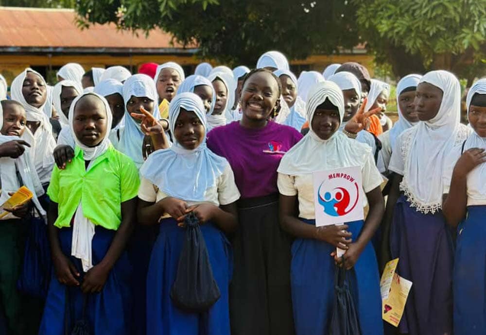 group of women standing outside smiling at the camera
