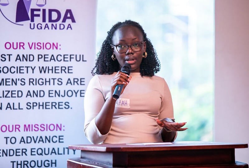 young woman speaking at a podium