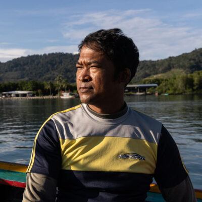 man on a fishing boat on the water
