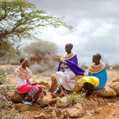 three indigenous women sitting together