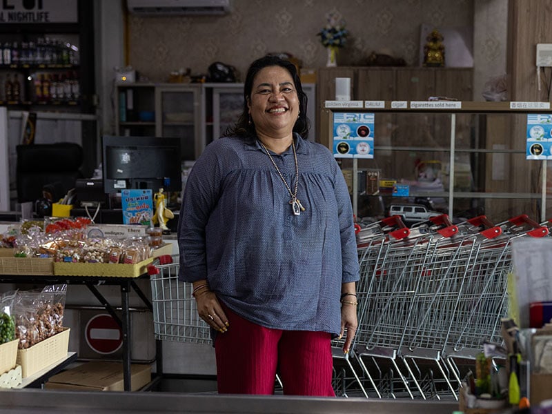 woman standing and smiling at camera