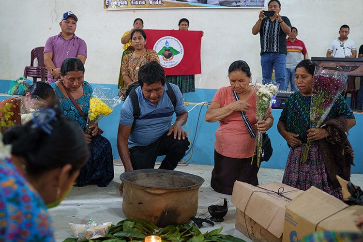 a few people gathered in a room