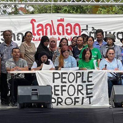 group of people behind a banner