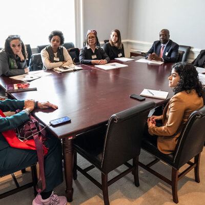 group of people around a table in an office at the US Capitol