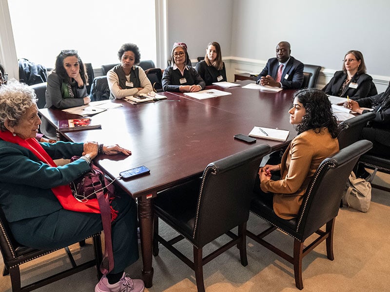 group of people around a table in an office at the US Capitol