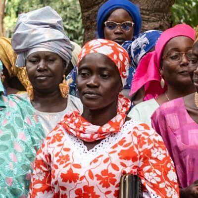 group of women in colorful attire