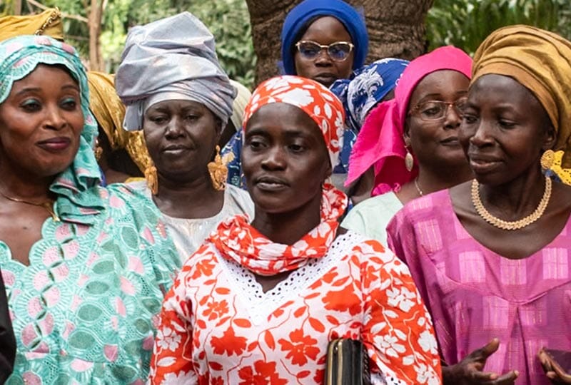group of women in colorful attire